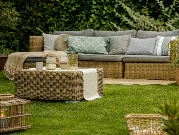 Modern lounge with wicker furniture in the garden